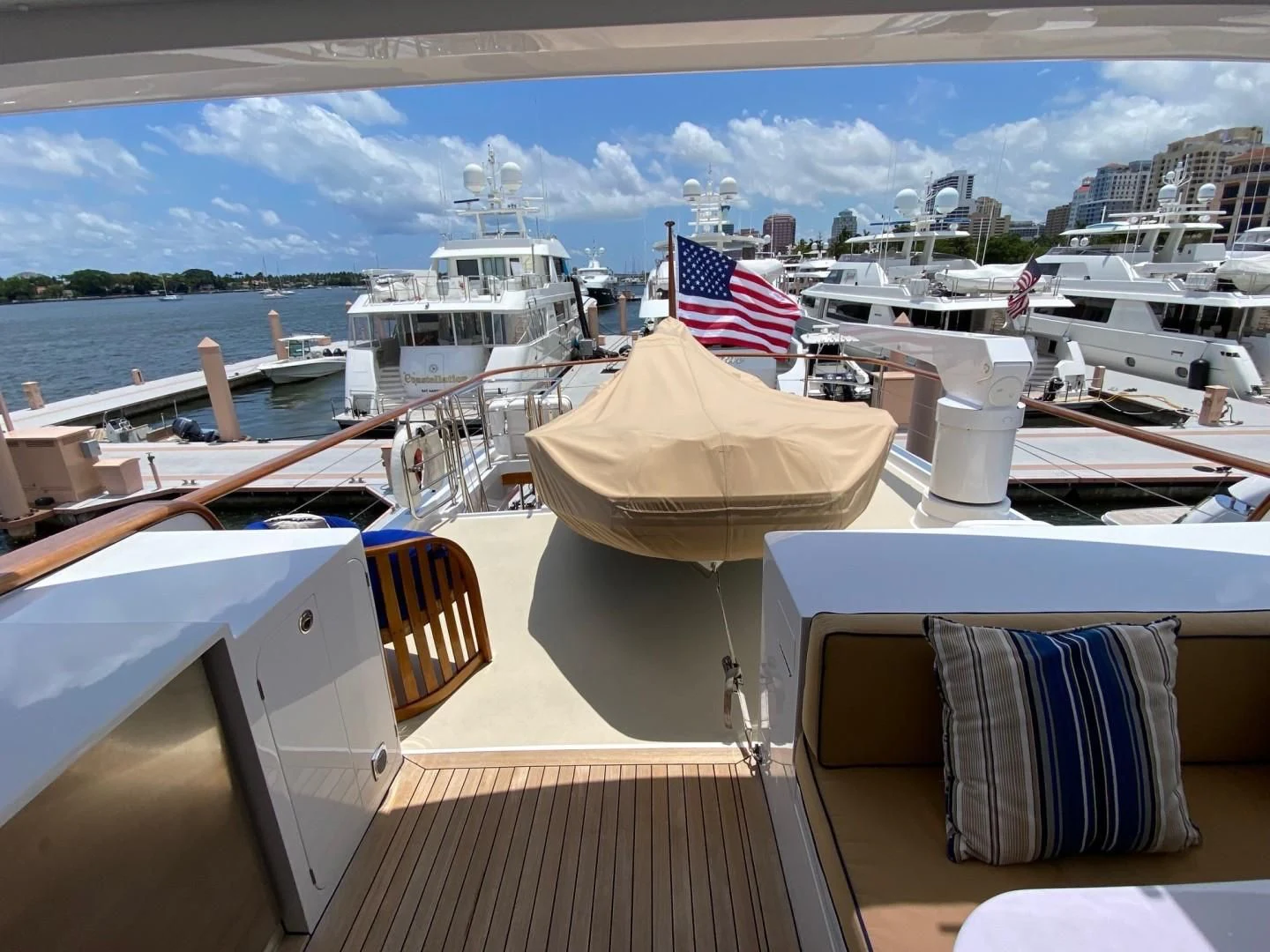 a deck with boats and a flag aboard SEA BOLD Yacht for Sale