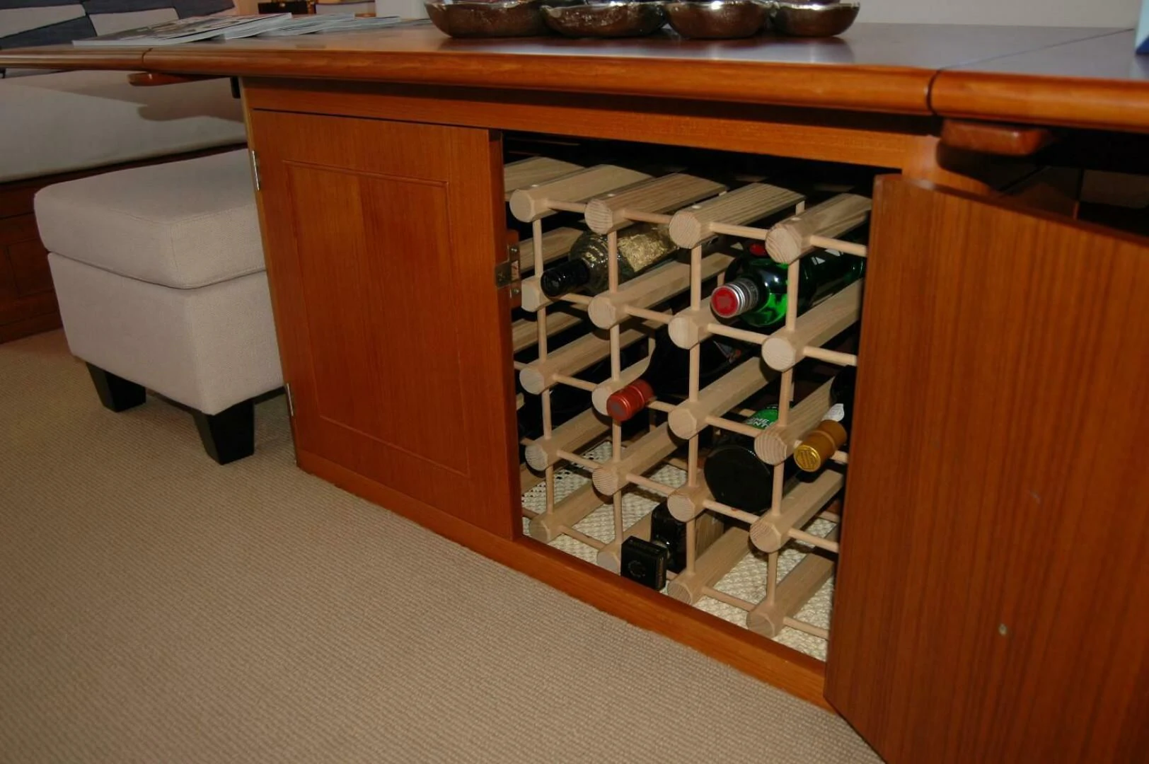 a cabinet with a variety of items on it aboard SEA BOLD Yacht for Sale