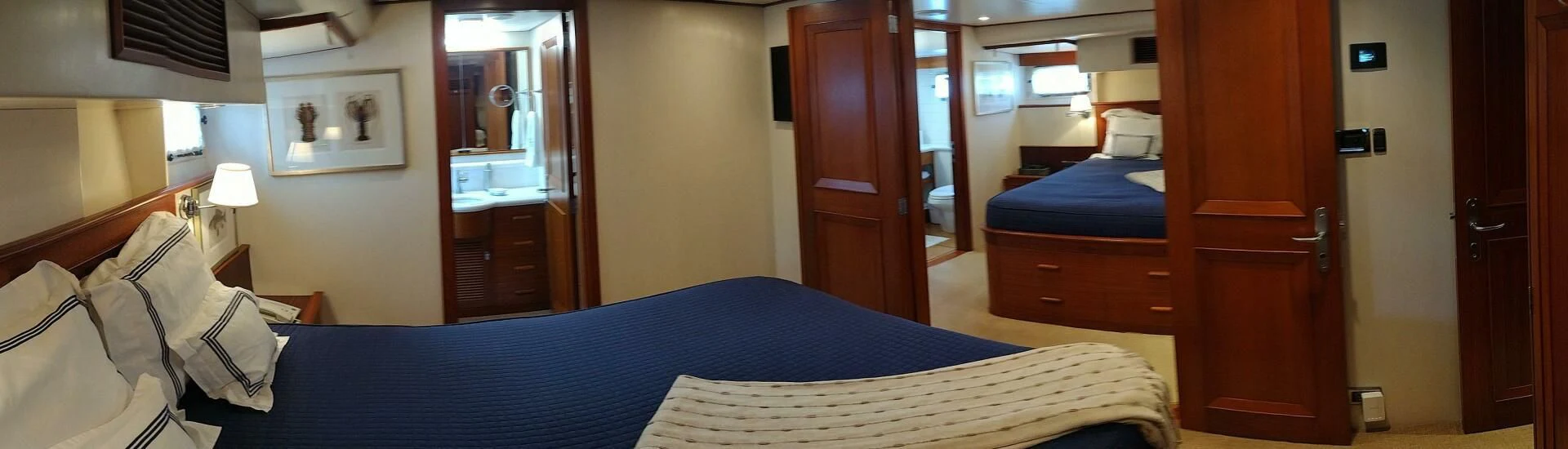 a hotel room with a bed and a door aboard SEA BOLD Yacht for Sale