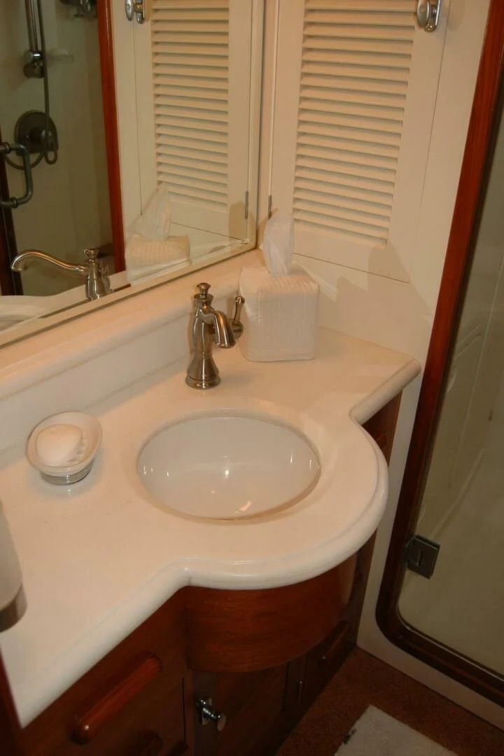 a bathroom sink with a mirror aboard SEA BOLD Yacht for Sale