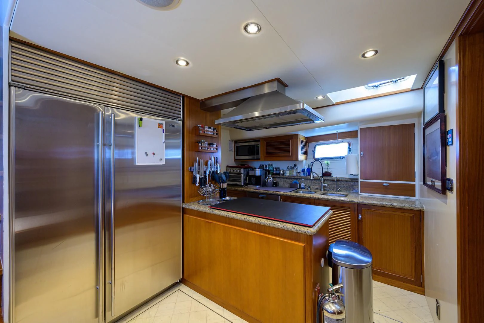 a kitchen with a stainless steel refrigerator aboard SEA BOLD Yacht for Sale