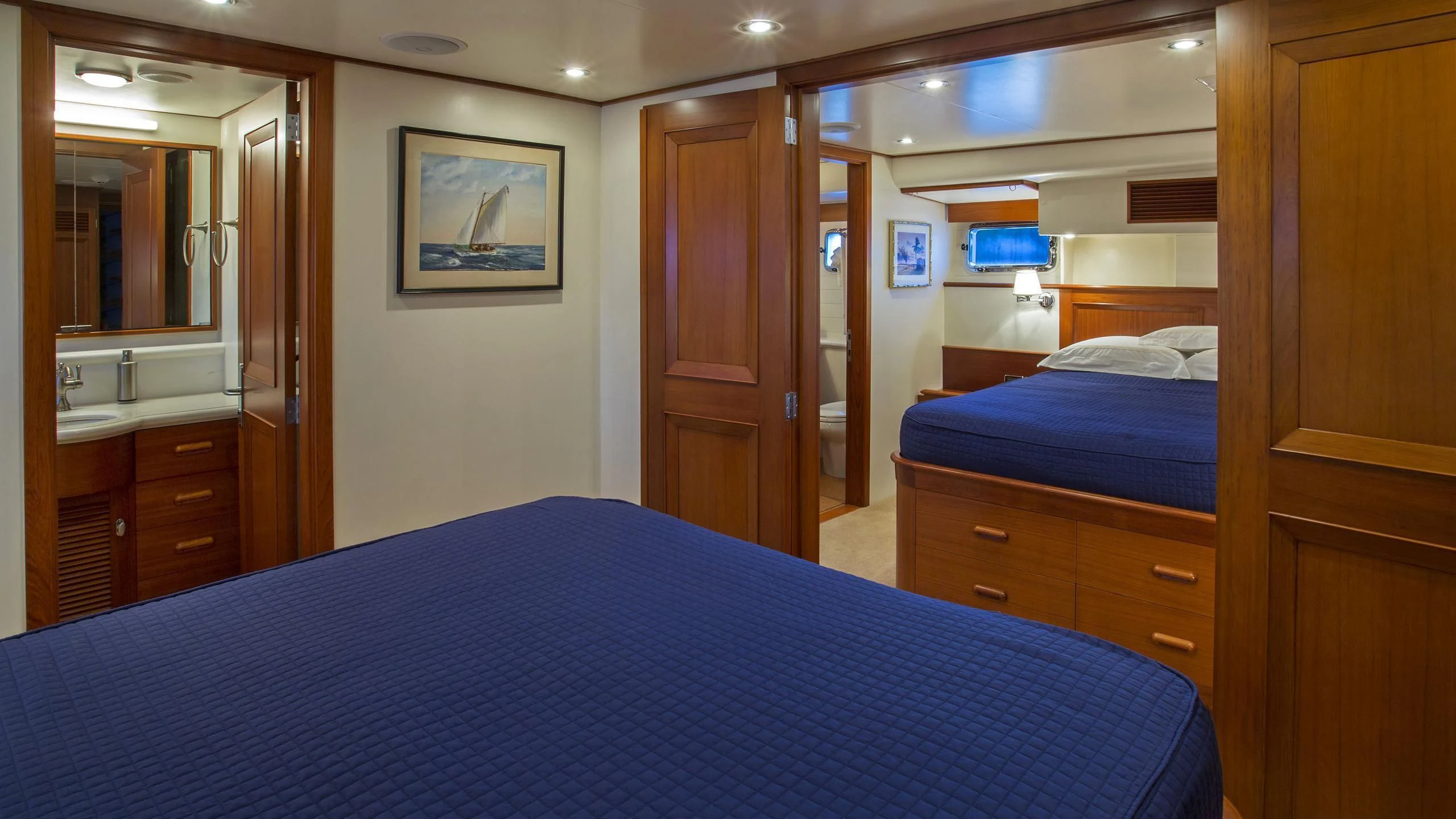 a bedroom with a bed and a desk aboard SEA BOLD Yacht for Sale