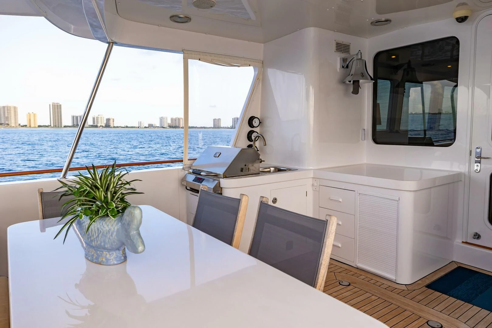 a white kitchen with a large window aboard SEA BOLD Yacht for Sale