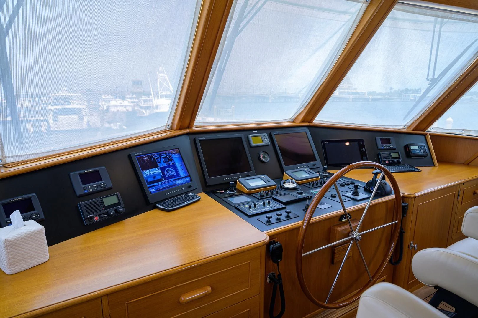 a desk with a computer and other electronics on it aboard SEA BOLD Yacht for Sale