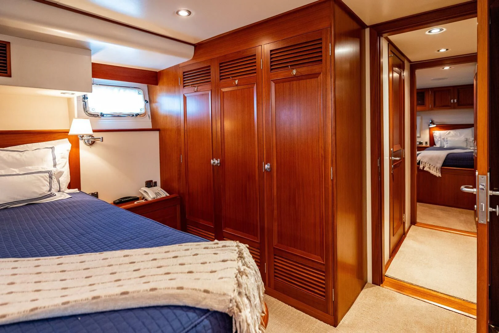 a room with a bed and a closet aboard SEA BOLD Yacht for Sale