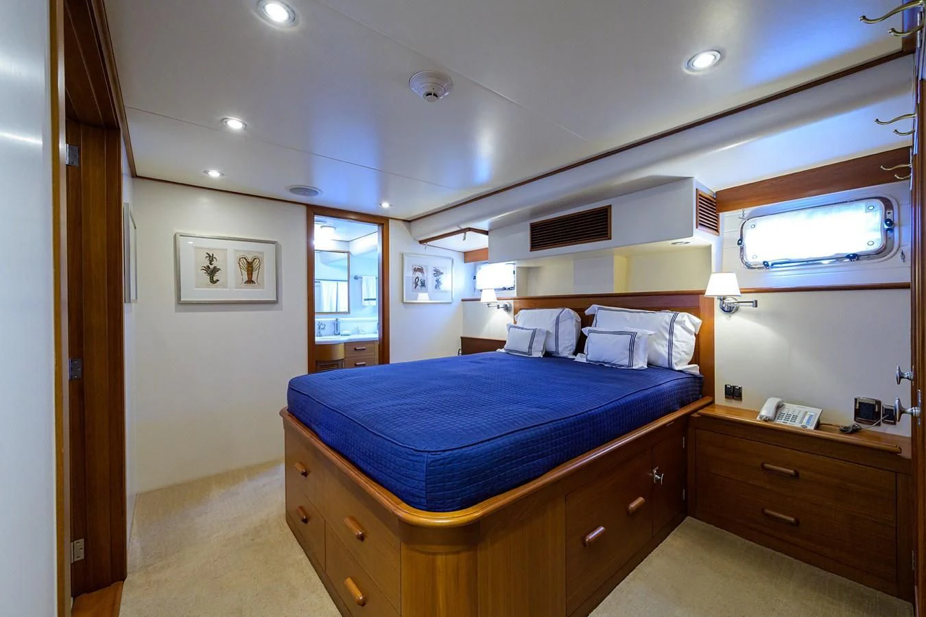 a bedroom with a bed and a window aboard SEA BOLD Yacht for Sale