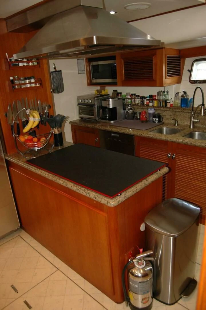 a kitchen with a countertop sink and a stove aboard SEA BOLD Yacht for Sale