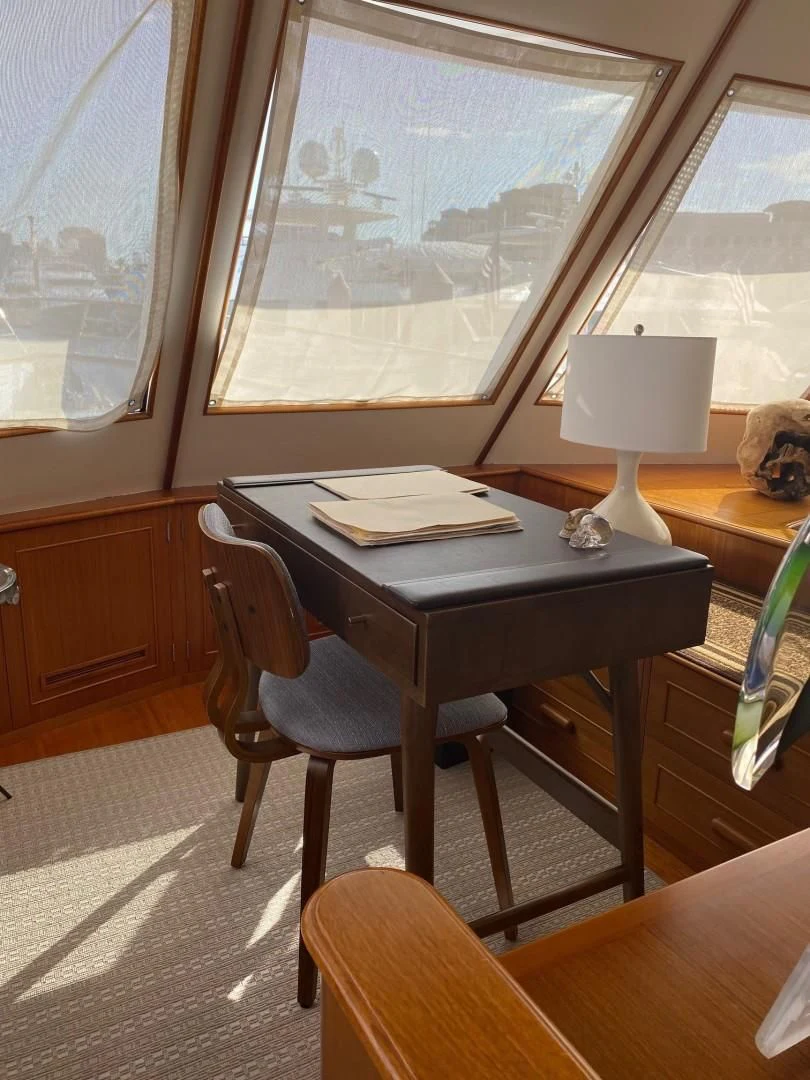 a table with a lamp on it aboard SEA BOLD Yacht for Sale