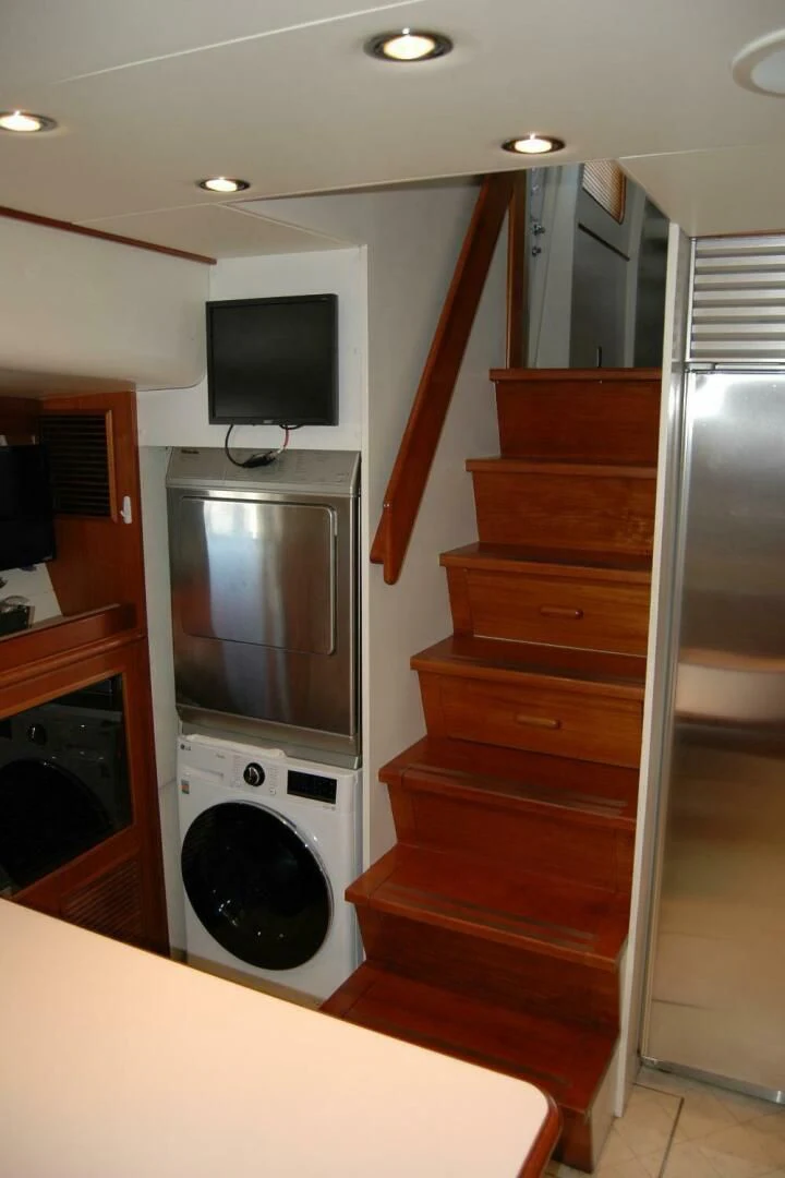 a kitchen with a microwave and a refrigerator aboard SEA BOLD Yacht for Sale