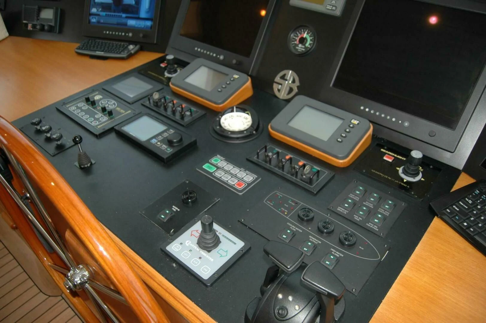 a table with a variety of electronics on it aboard SEA BOLD Yacht for Sale