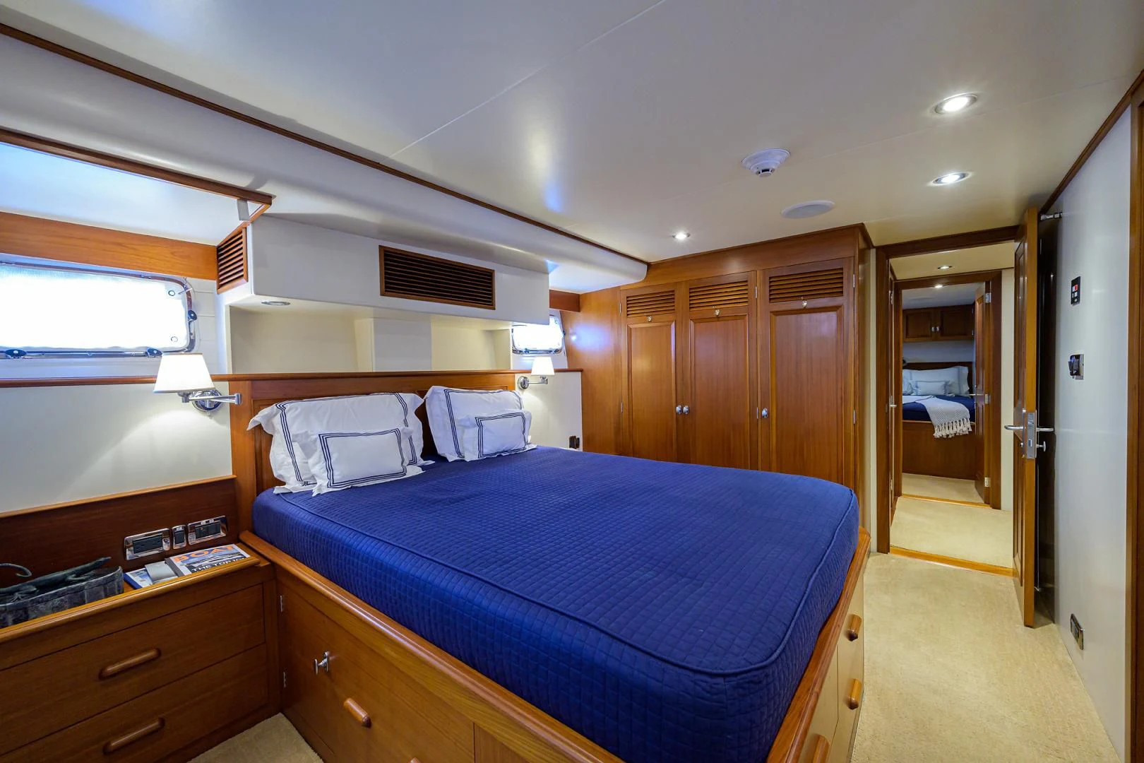 a bedroom with a bed and a mirror aboard SEA BOLD Yacht for Sale