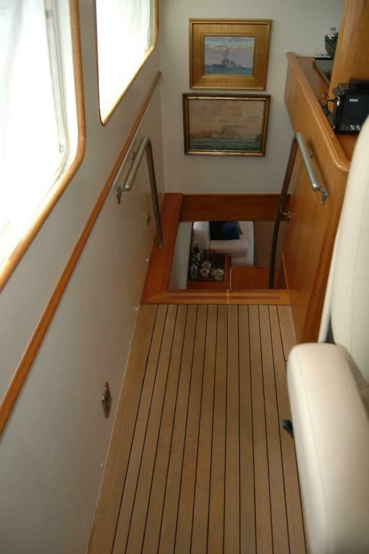 a wooden staircase with a mirror above it aboard SEA BOLD Yacht for Sale