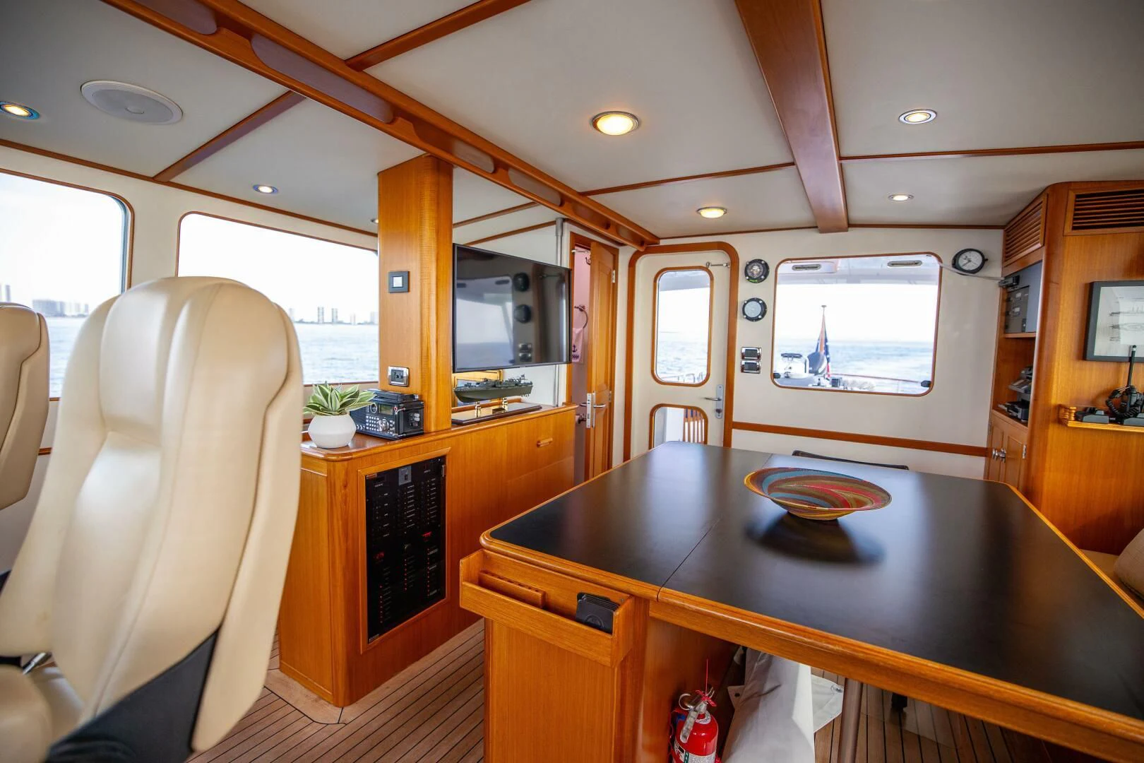 a kitchen with a table and chairs aboard SEA BOLD Yacht for Sale