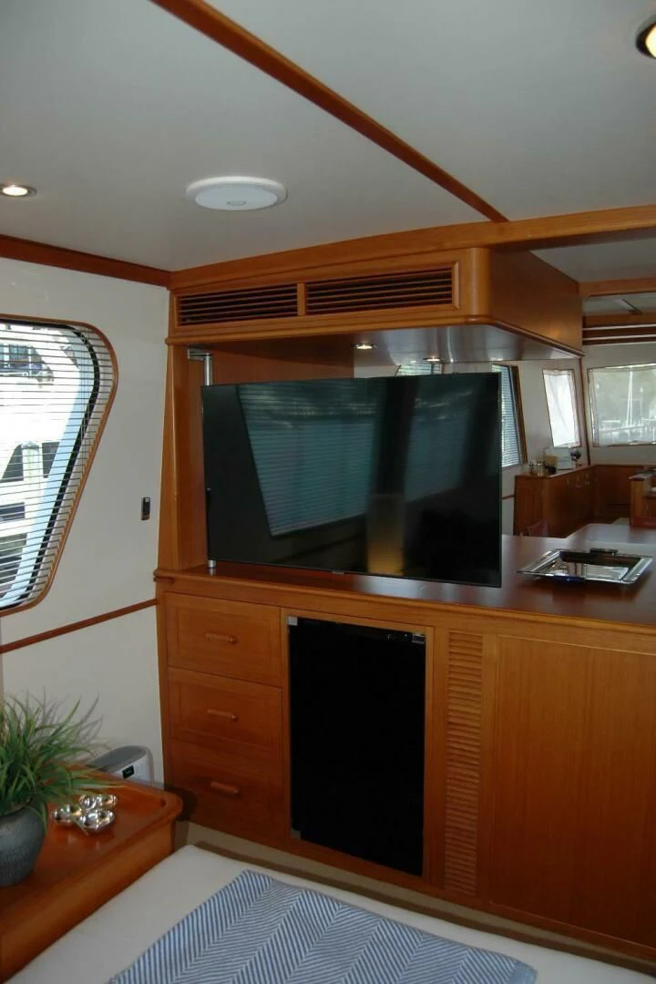 a room with a tv and a dresser aboard SEA BOLD Yacht for Sale