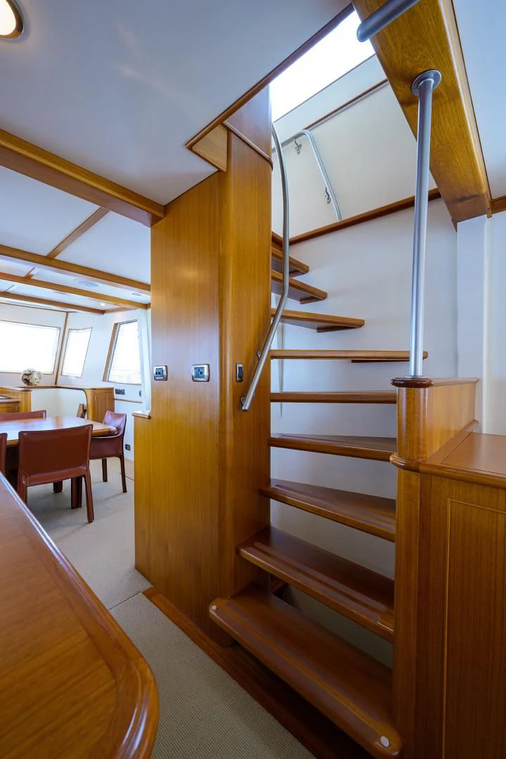 a wooden staircase in a room aboard SEA BOLD Yacht for Sale