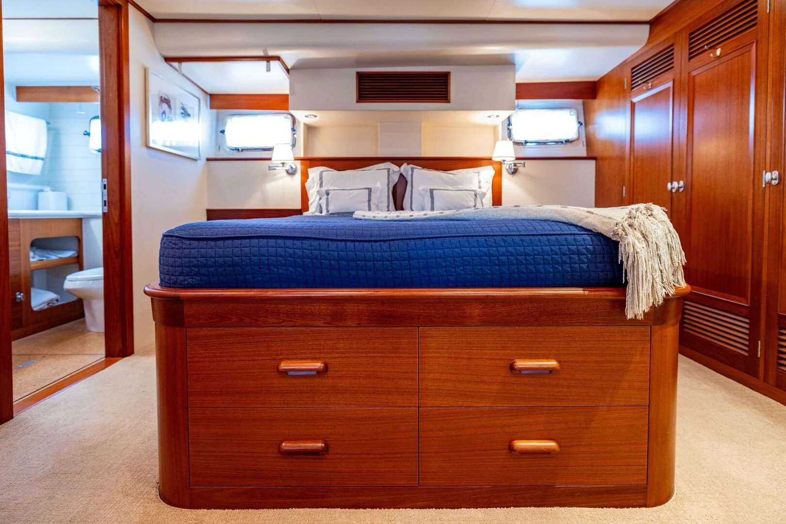 a bedroom with a bed and a closet aboard SEA BOLD Yacht for Sale