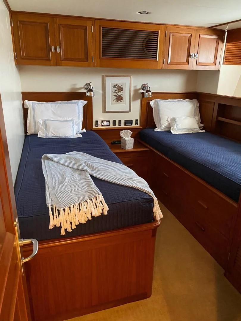 a bedroom with a couple of beds aboard SEA BOLD Yacht for Sale