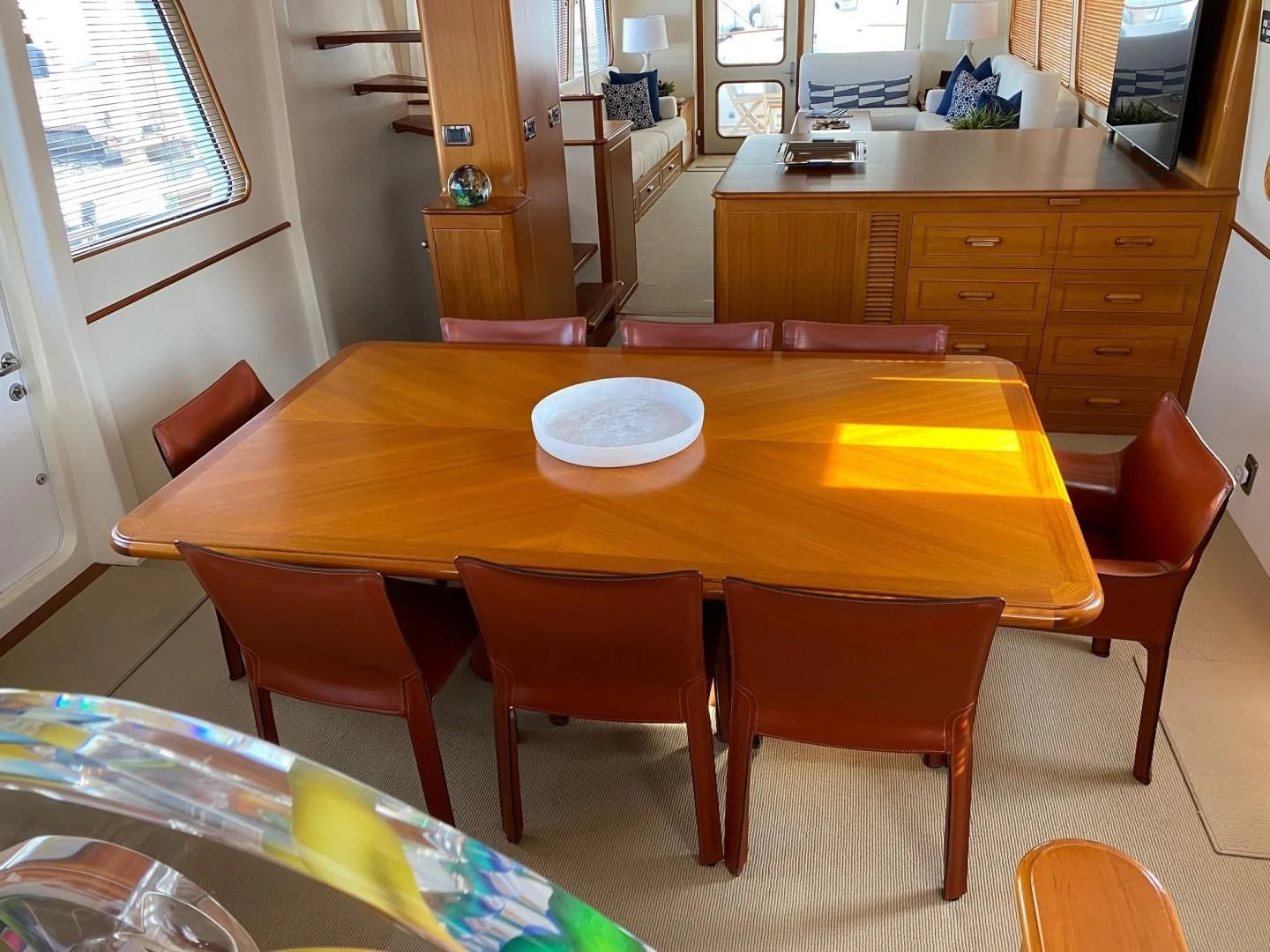 a dining table with chairs around it aboard SEA BOLD Yacht for Sale