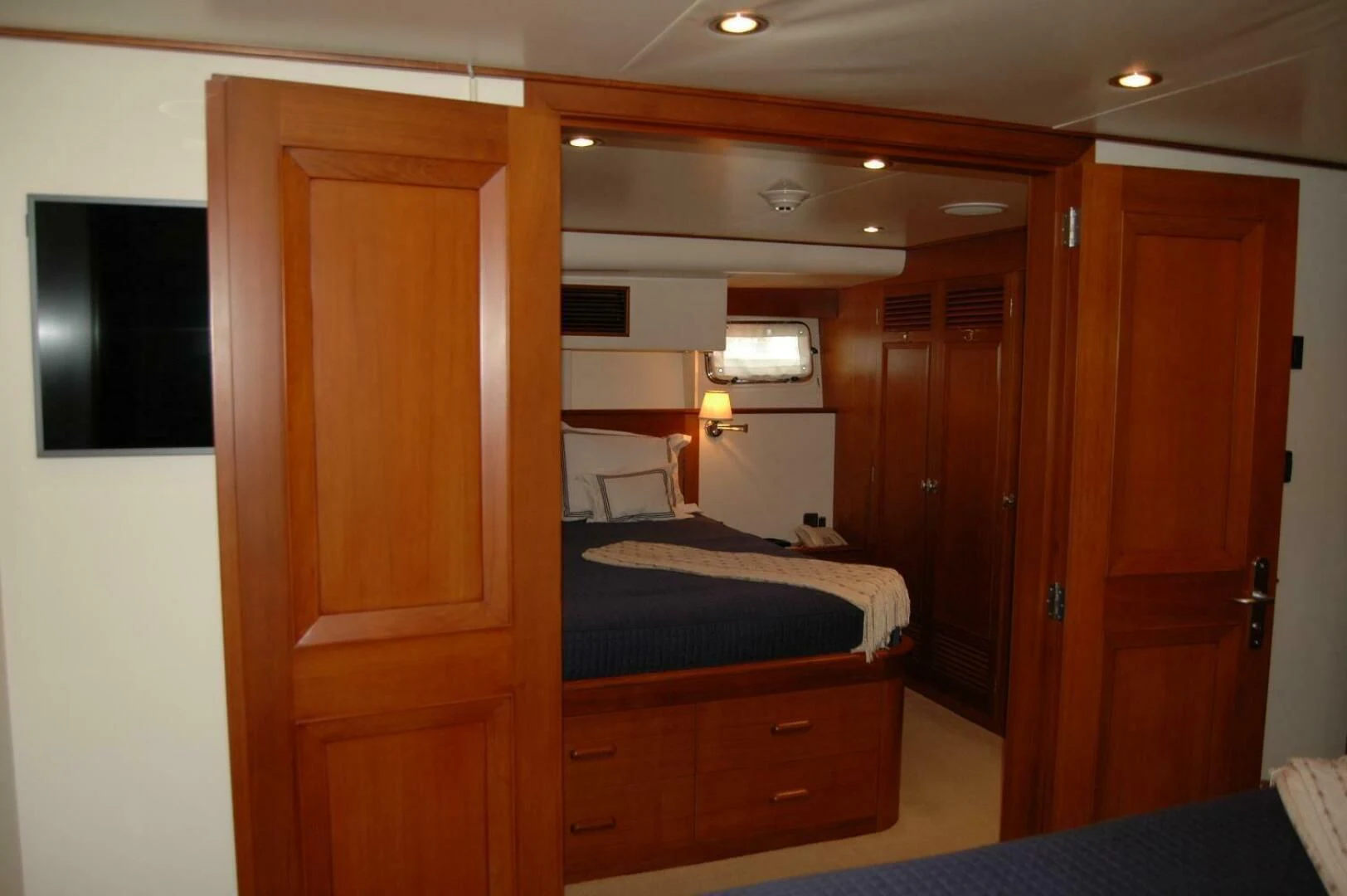 a room with a bed and a closet aboard SEA BOLD Yacht for Sale
