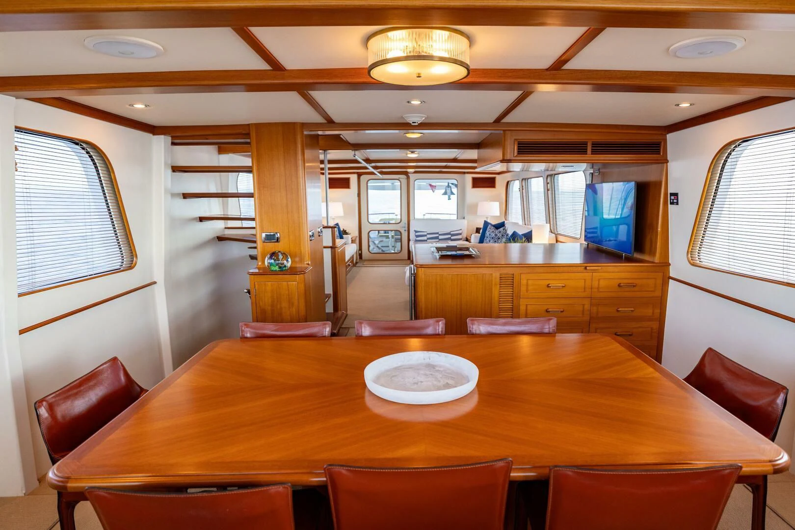 a large kitchen with a table and chairs aboard SEA BOLD Yacht for Sale