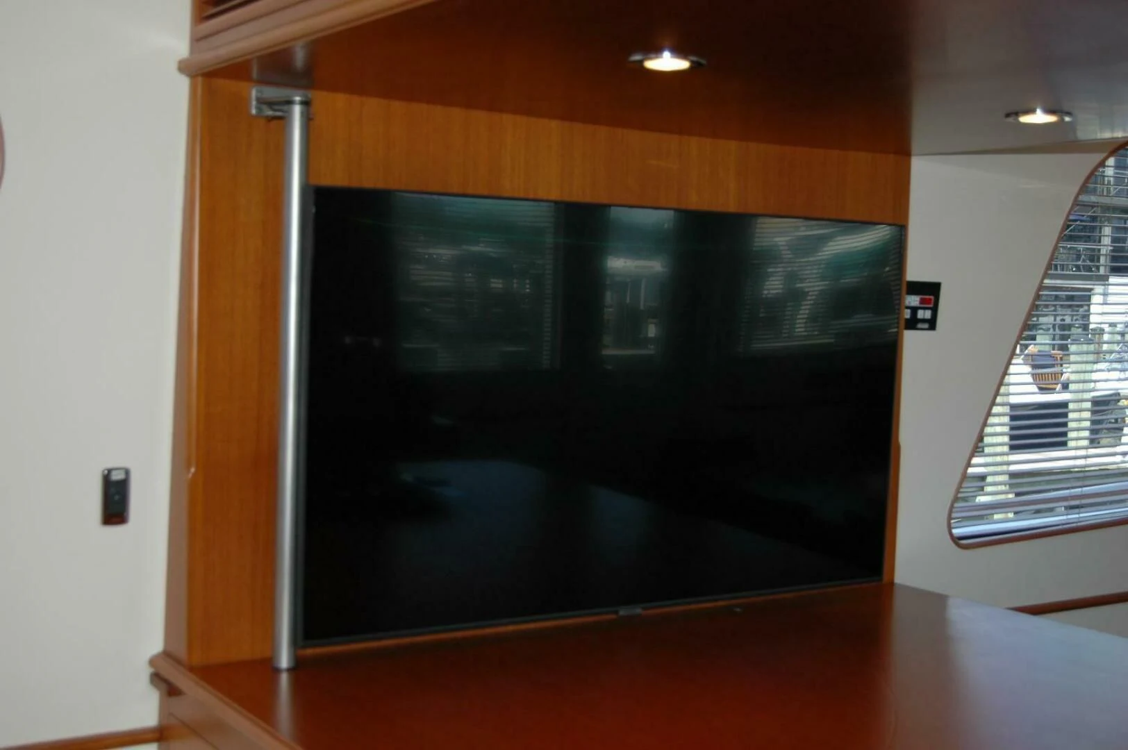 a large black screen on a wooden table aboard SEA BOLD Yacht for Sale