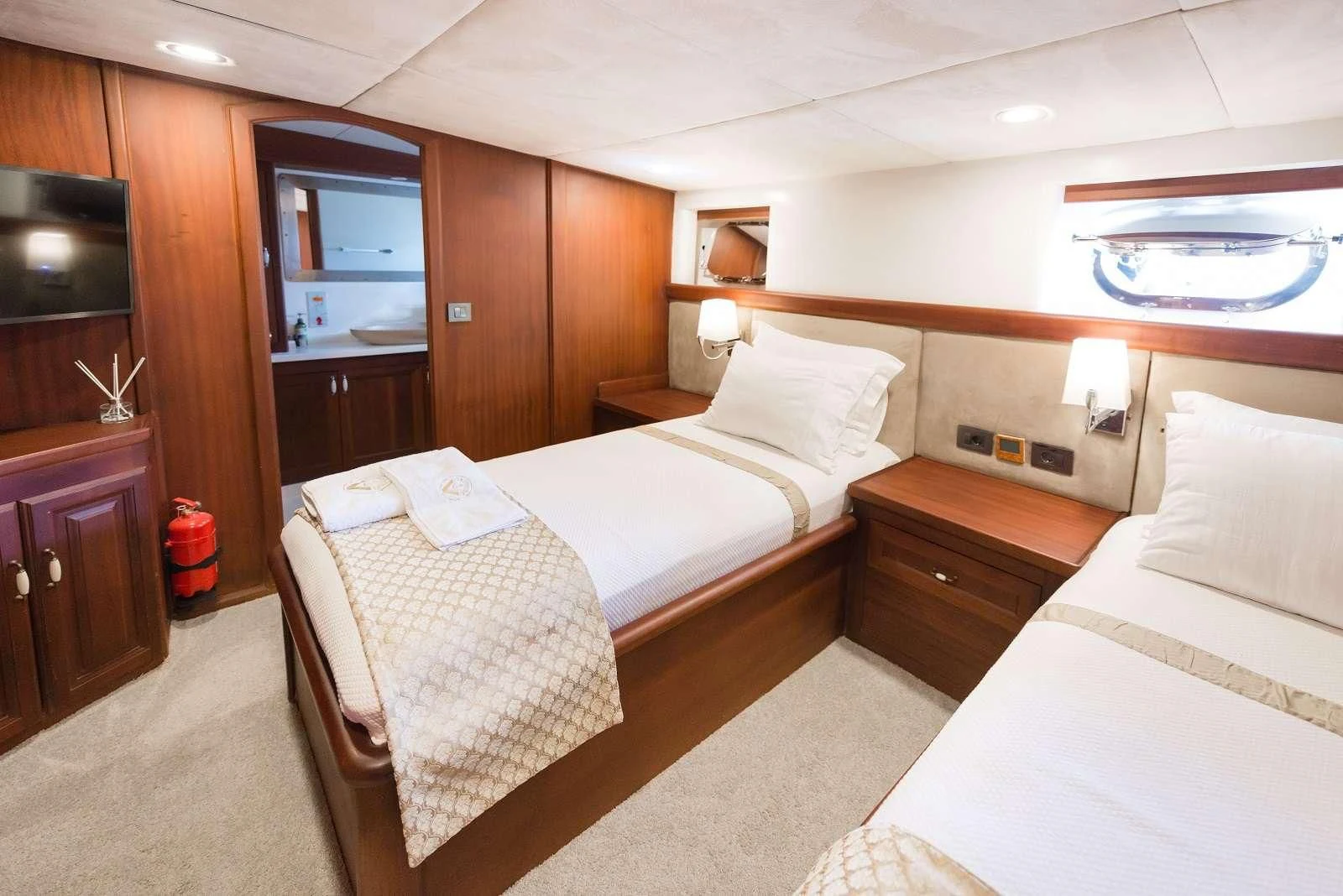 a hotel room with two beds aboard VIRTUOSO Yacht for Sale