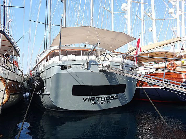 a group of boats are parked in a harbor aboard VIRTUOSO Yacht for Sale