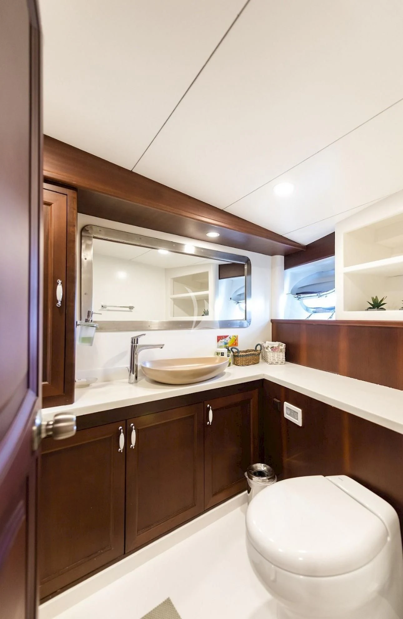 a bathroom with a toilet and a sink aboard VIRTUOSO Yacht for Sale