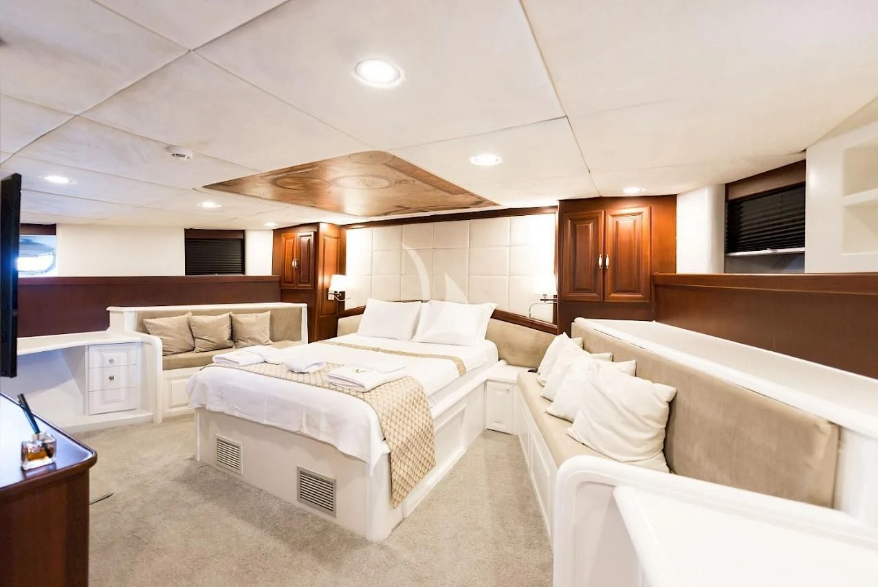a room with a few beds aboard VIRTUOSO Yacht for Sale