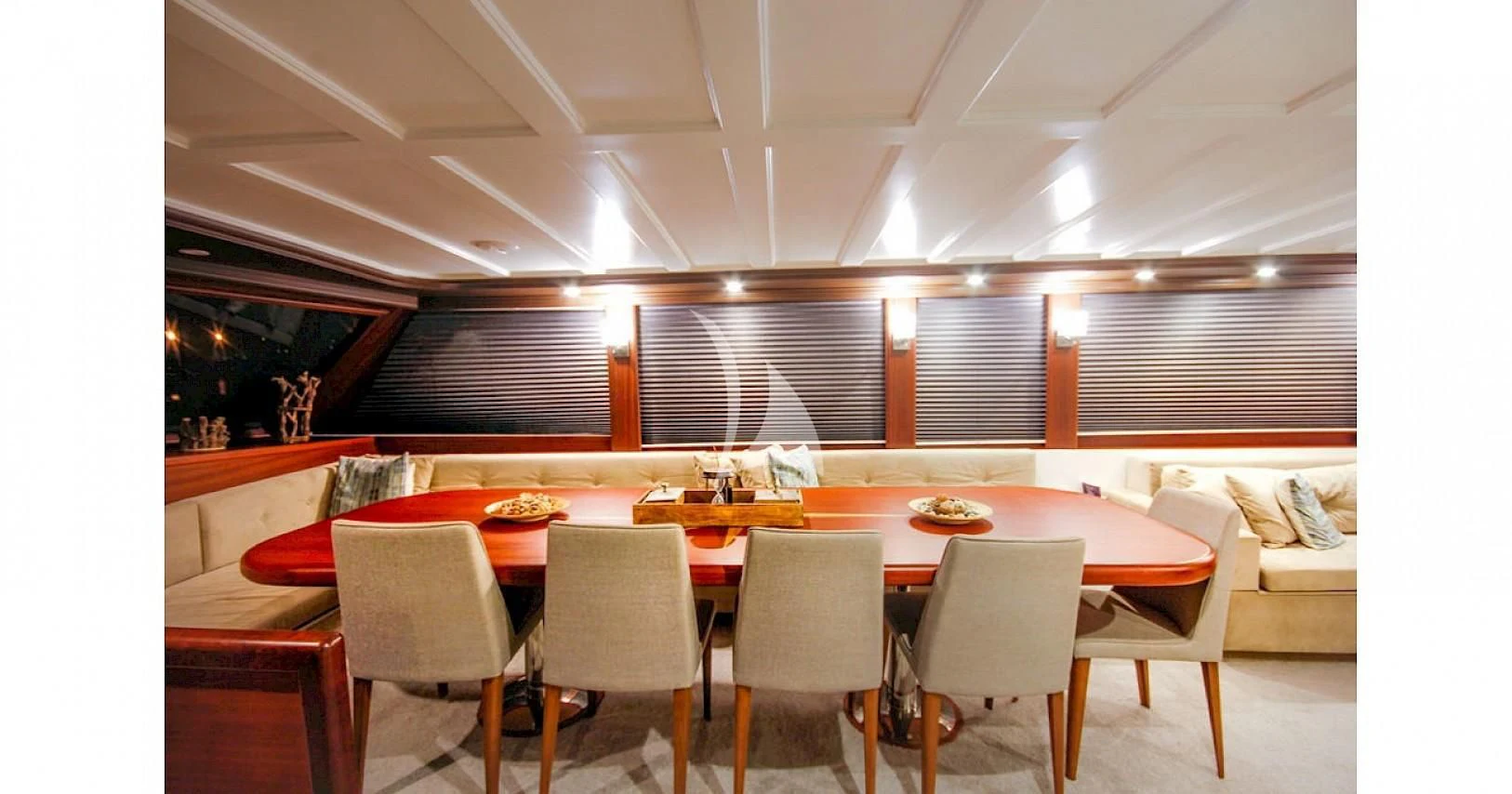 a room with a table and chairs aboard VIRTUOSO Yacht for Sale