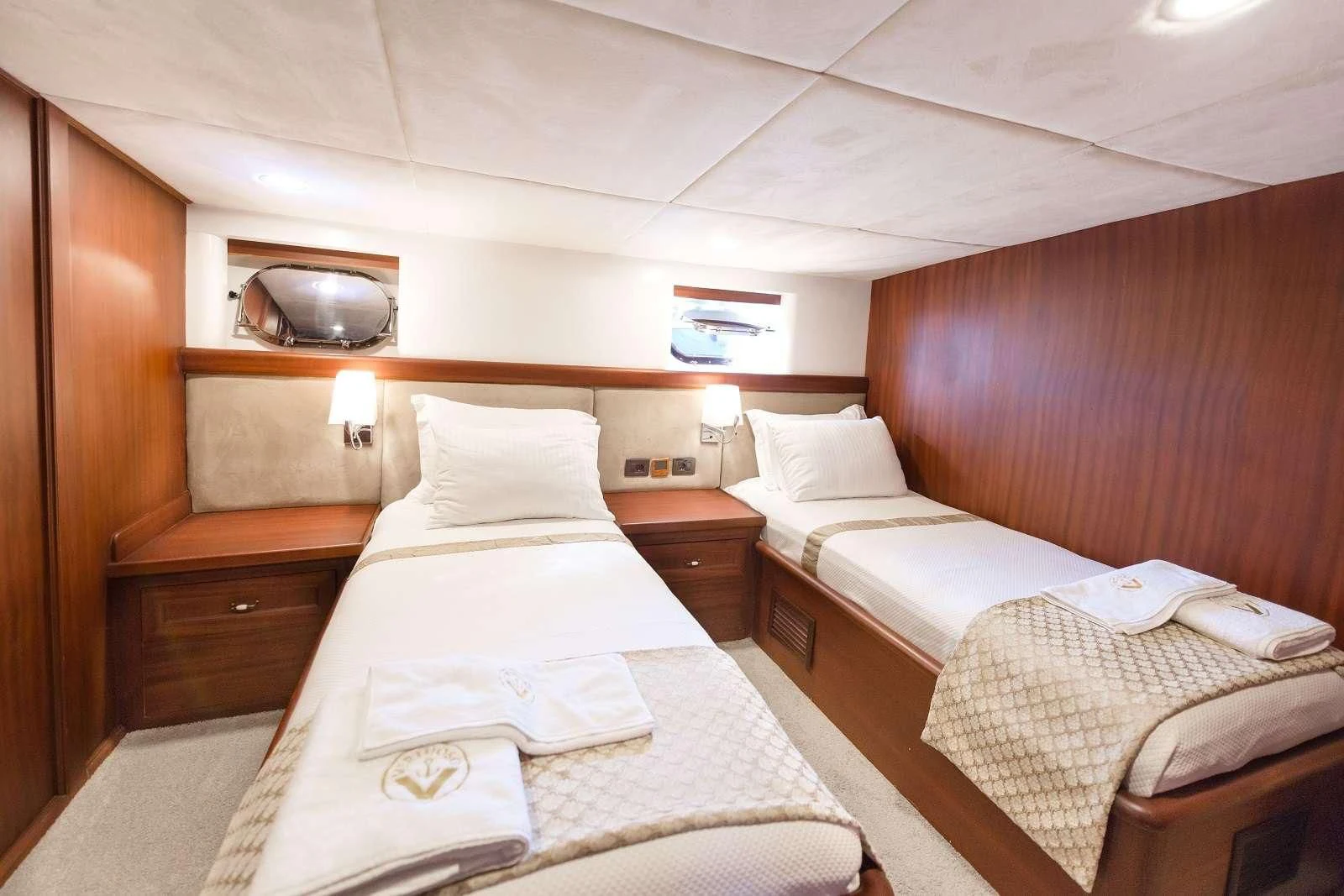 a couple of beds in a room aboard VIRTUOSO Yacht for Sale