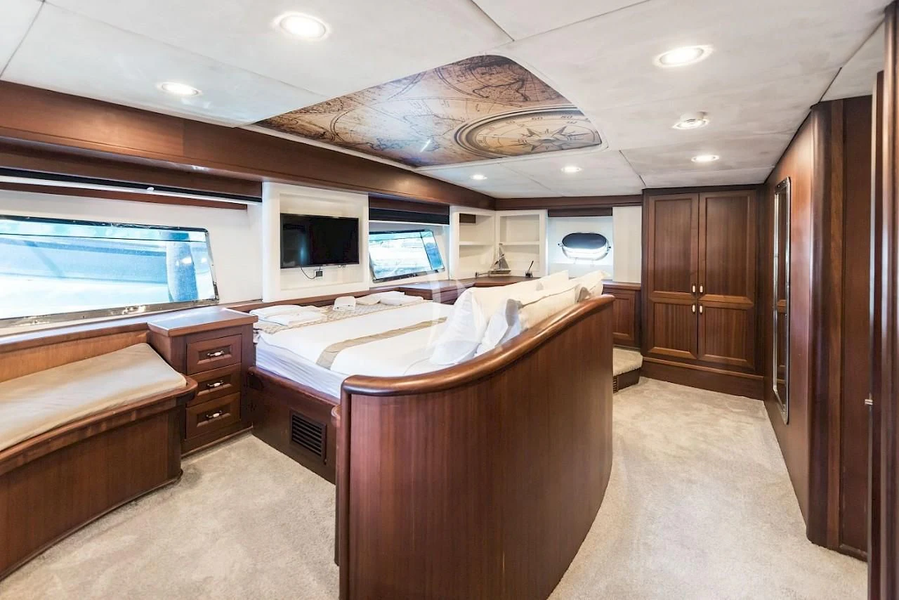 a large bedroom with a large bed aboard VIRTUOSO Yacht for Sale