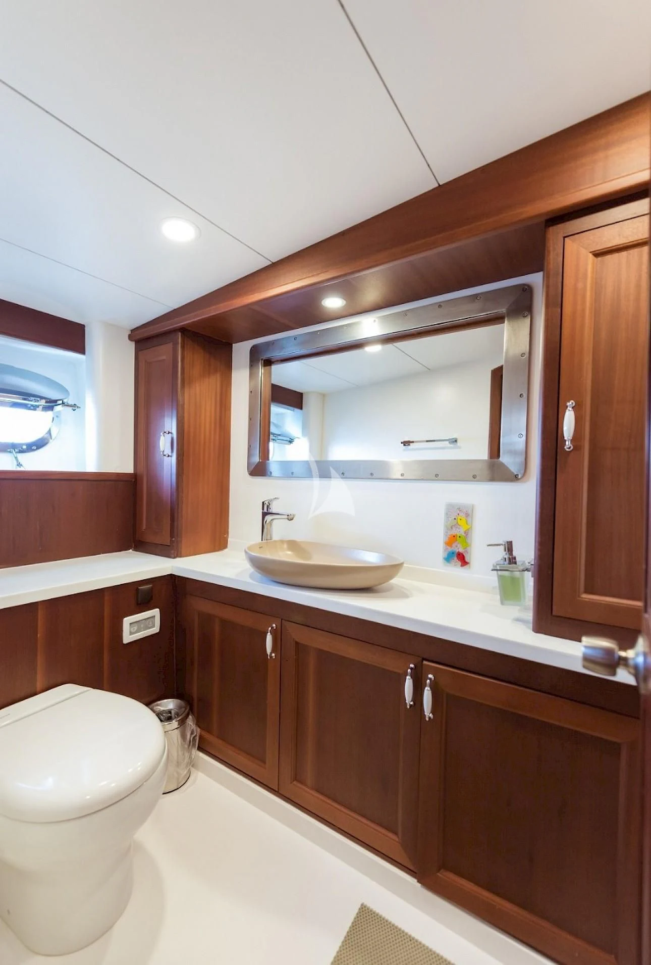 a bathroom with a sink and a mirror aboard VIRTUOSO Yacht for Sale