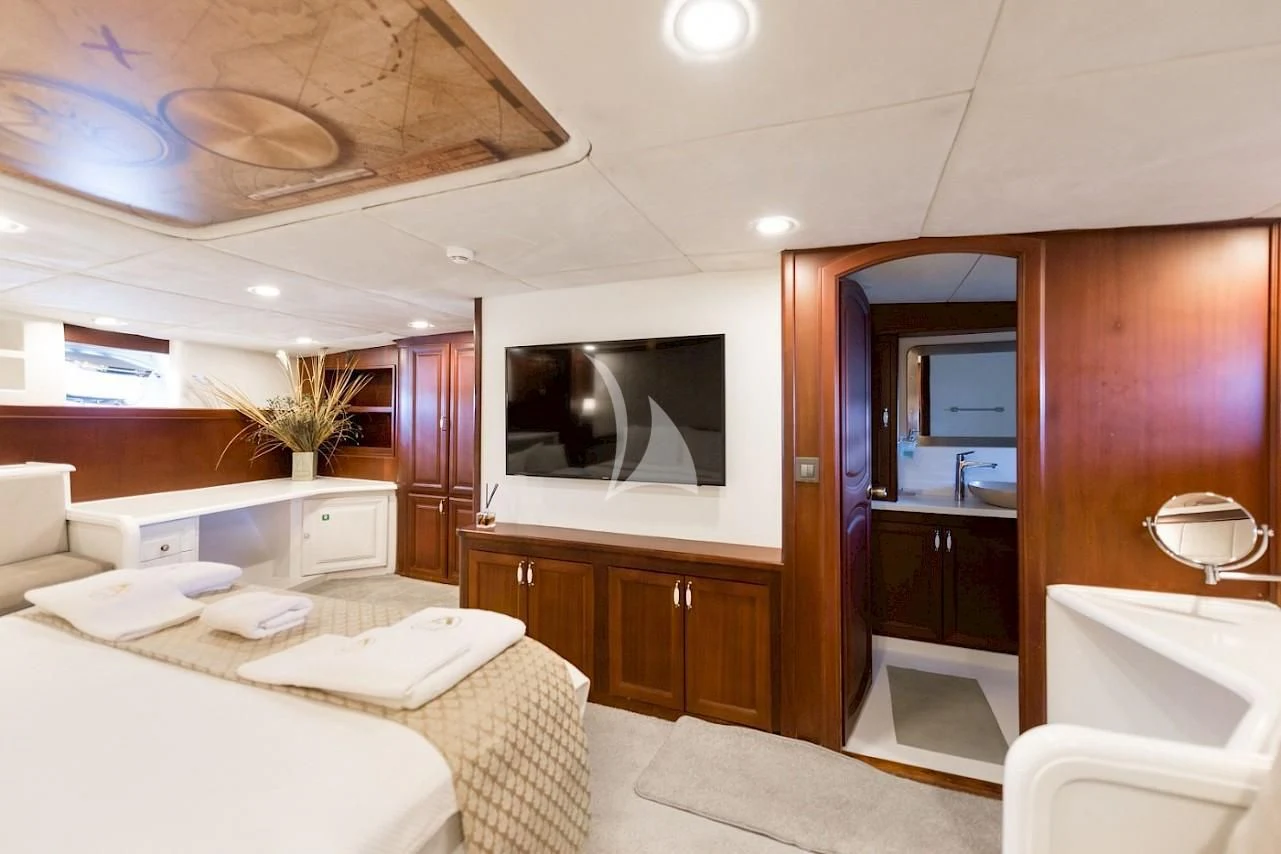 a modern bathroom with a large mirror aboard VIRTUOSO Yacht for Sale