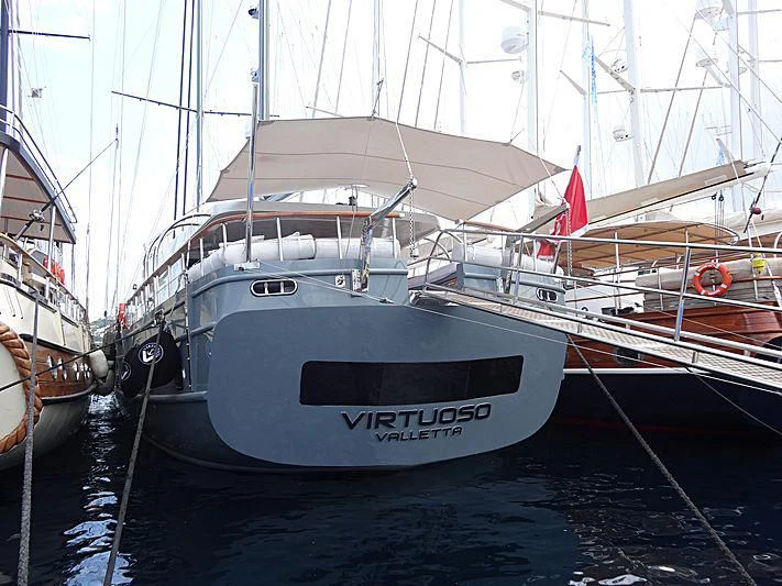 a group of boats are parked in a harbor aboard VIRTUOSO Yacht for Sale