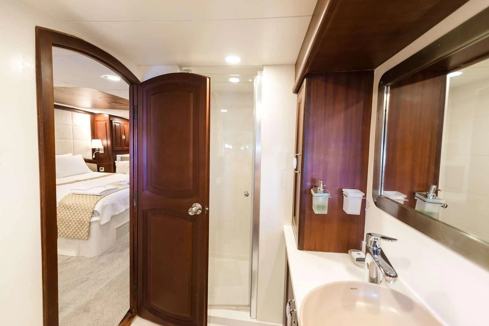 a bathroom with a sink and a mirror aboard VIRTUOSO Yacht for Sale
