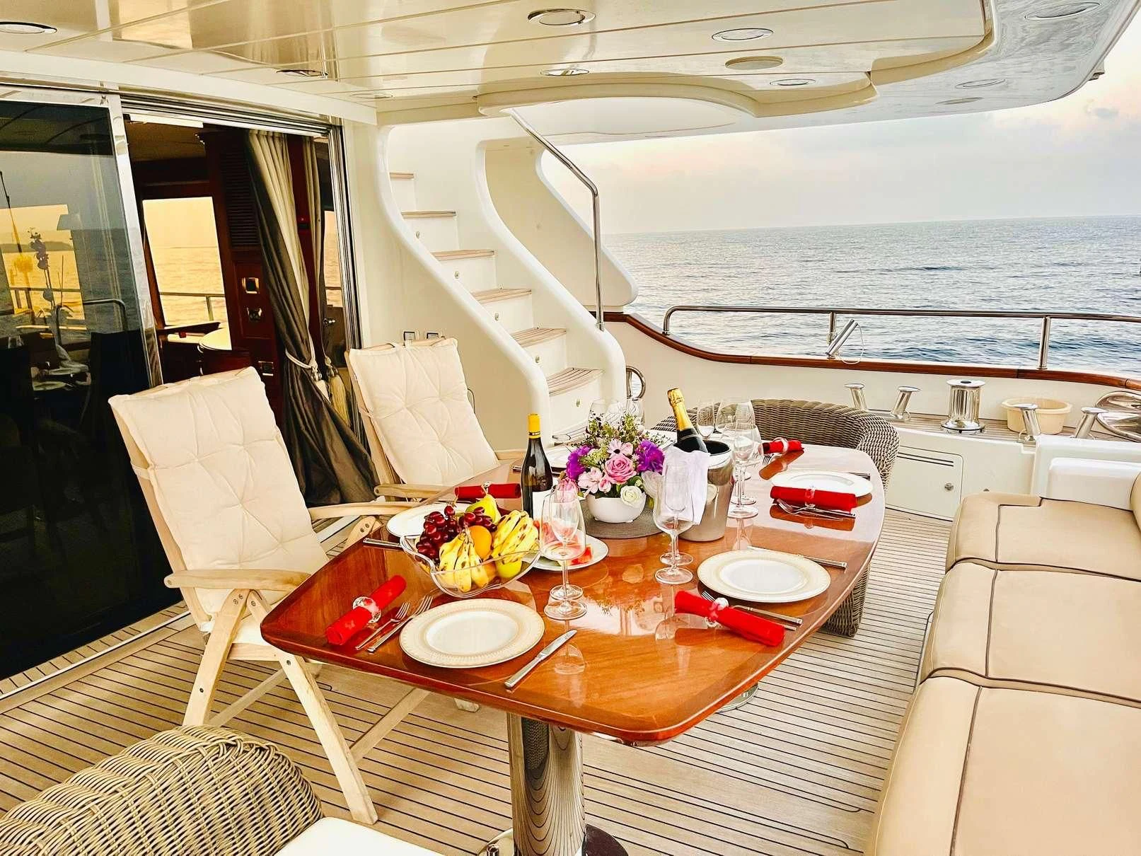 a table with plates and glasses on it aboard GALAKTIKA SKAY Yacht for Sale