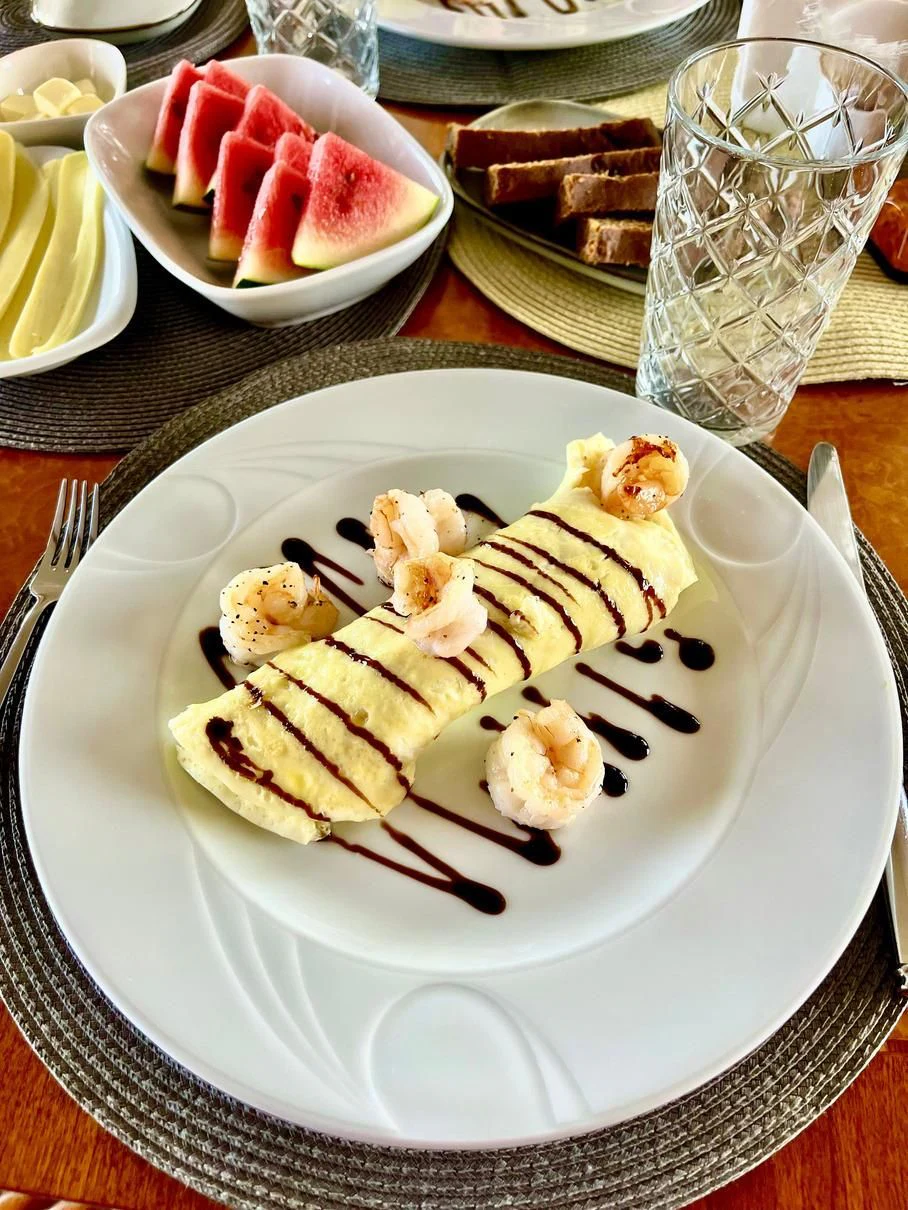 a plate of waffles and fruit aboard GALAKTIKA SKAY Yacht for Sale