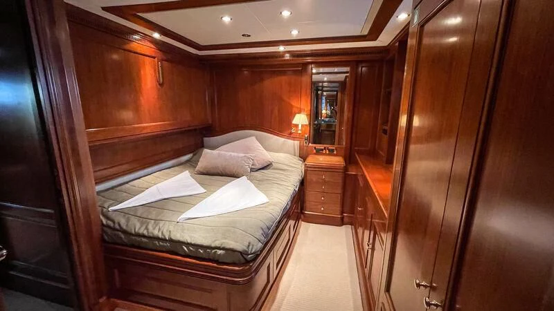 a room with a bed and a mirror aboard GALAKTIKA SKAY Yacht for Sale