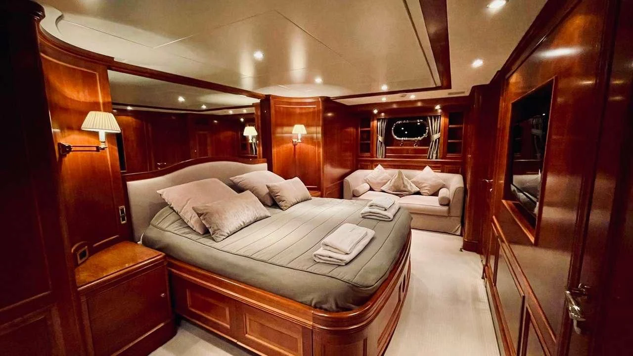 a room with a bed and a couch aboard GALAKTIKA SKAY Yacht for Sale