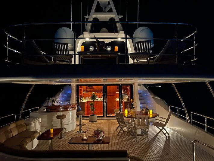 a room with a table chairs and a window aboard GALAKTIKA SKAY Yacht for Sale