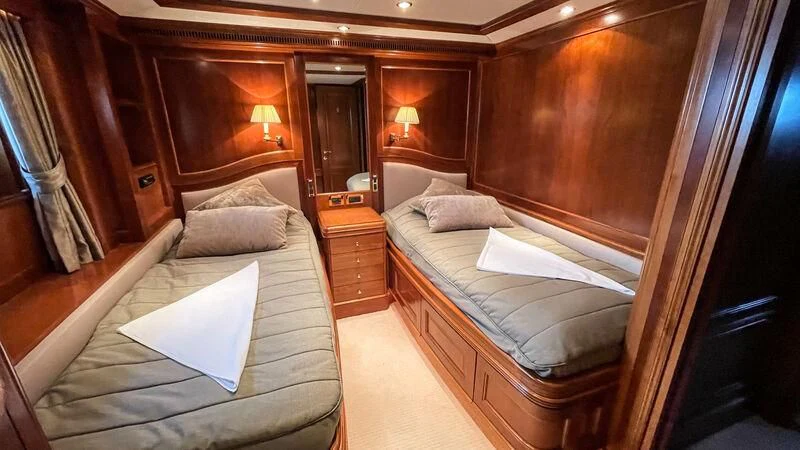 a room with a bed and a desk aboard GALAKTIKA SKAY Yacht for Sale