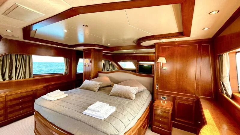 a bed in a room aboard GALAKTIKA SKAY Yacht for Sale