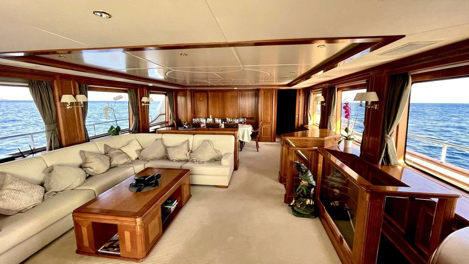 a living room with a couch and a table aboard GALAKTIKA SKAY Yacht for Sale