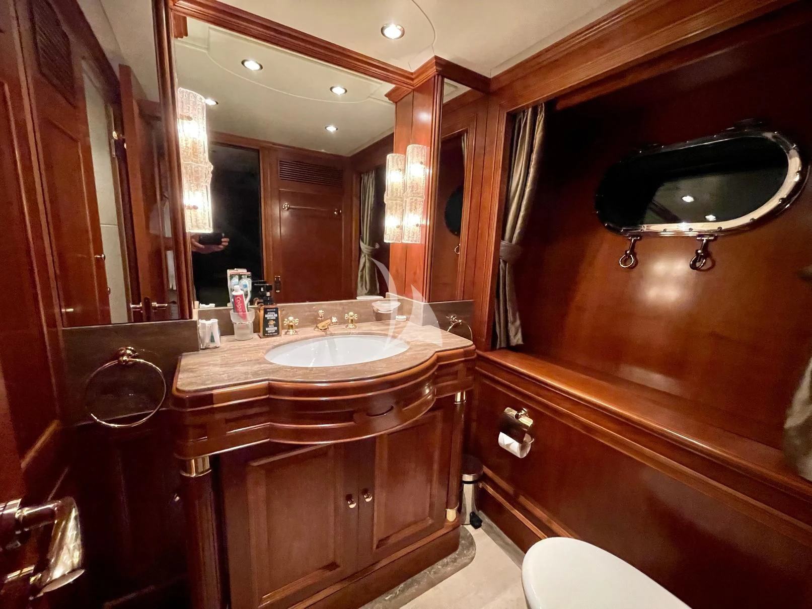 a bathroom with a sink and a mirror aboard GALAKTIKA SKAY Yacht for Sale