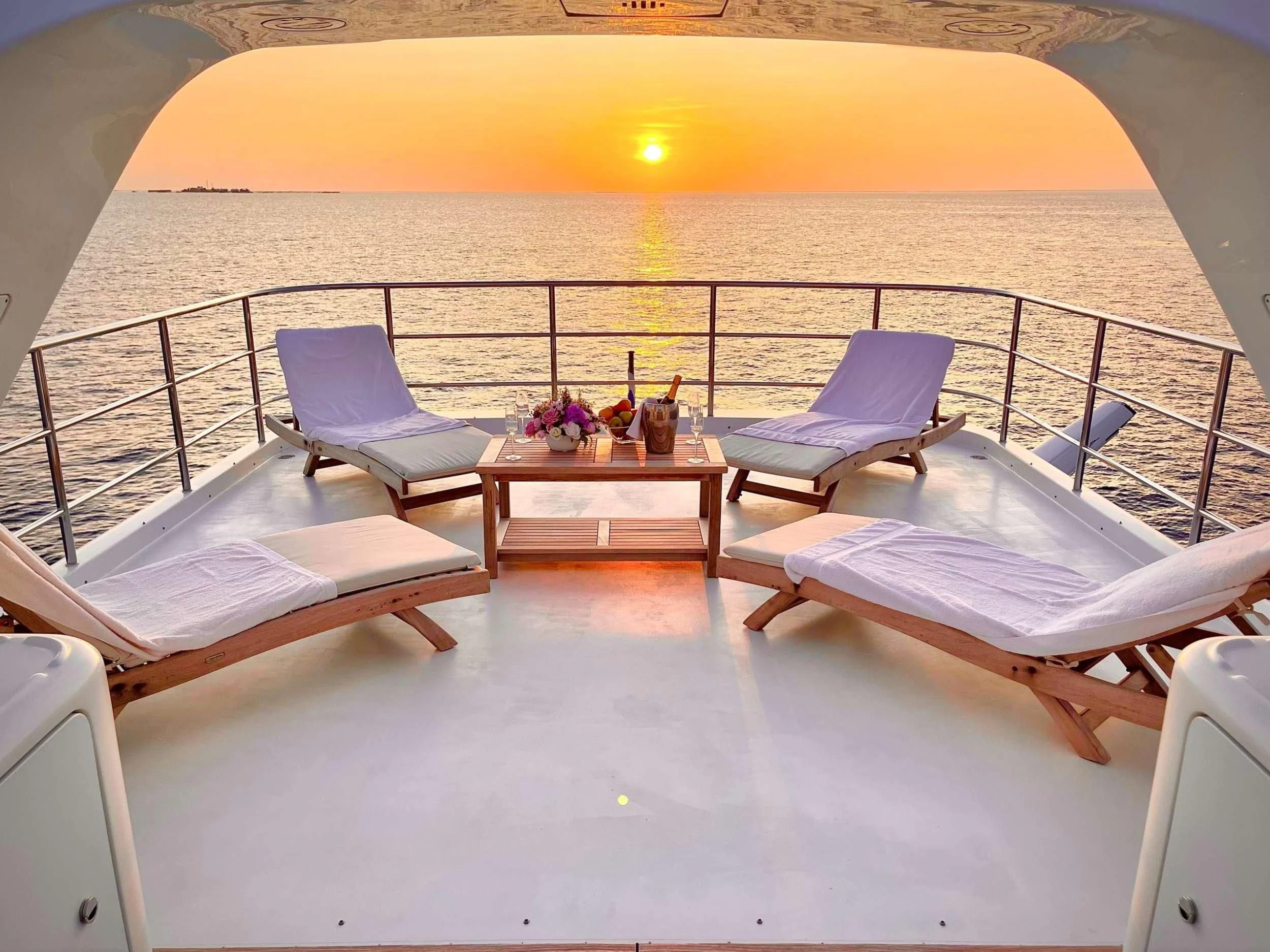 a balcony with beds and chairs aboard GALAKTIKA SKAY Yacht for Sale