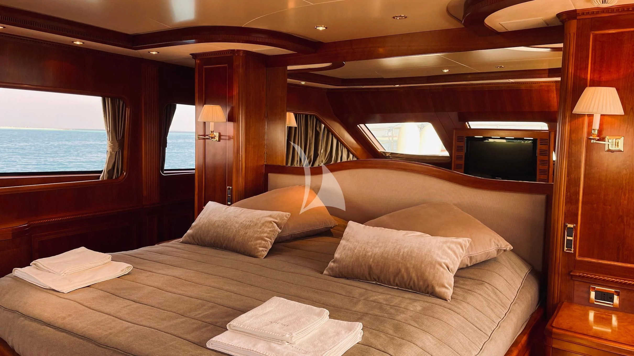 a bed with pillows on it aboard GALAKTIKA SKAY Yacht for Sale