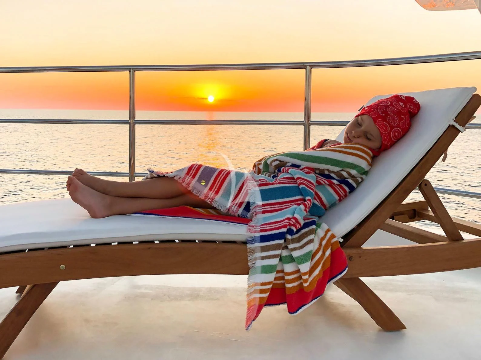 a person lying on a bench aboard GALAKTIKA SKAY Yacht for Sale