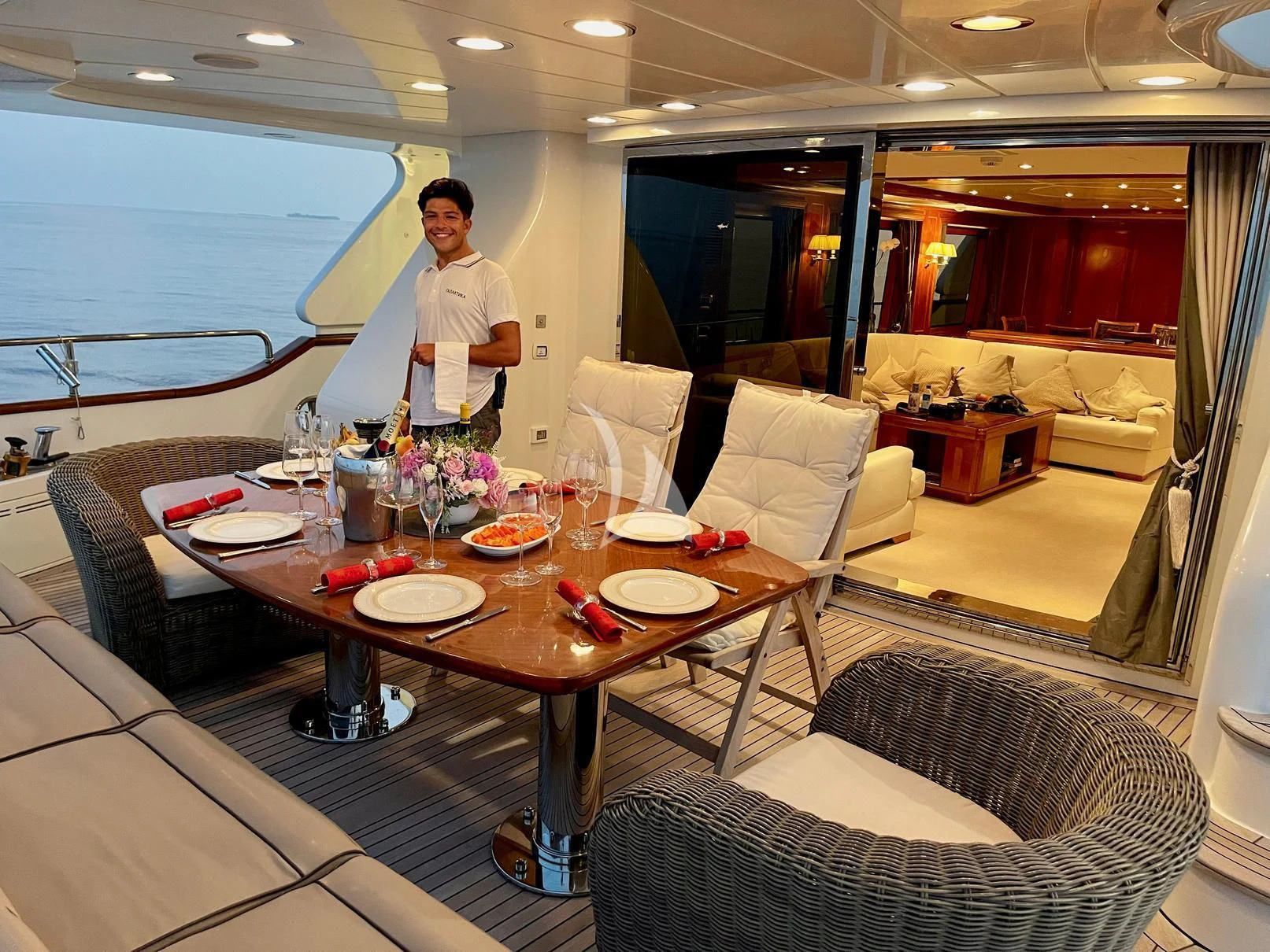 a person standing in a room with a table and chairs aboard GALAKTIKA SKAY Yacht for Sale