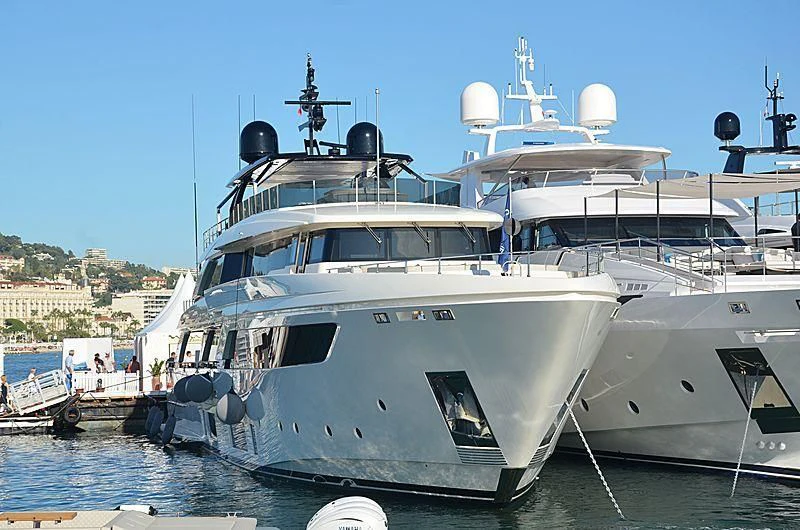 a large white boat in the water aboard APRIL Yacht for Sale